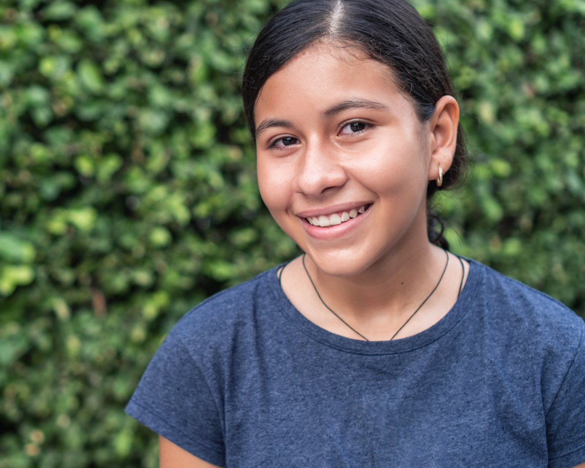smiling-latina-teen-outdoor-portrait-hero smiling latina teen outdoor portrait hero