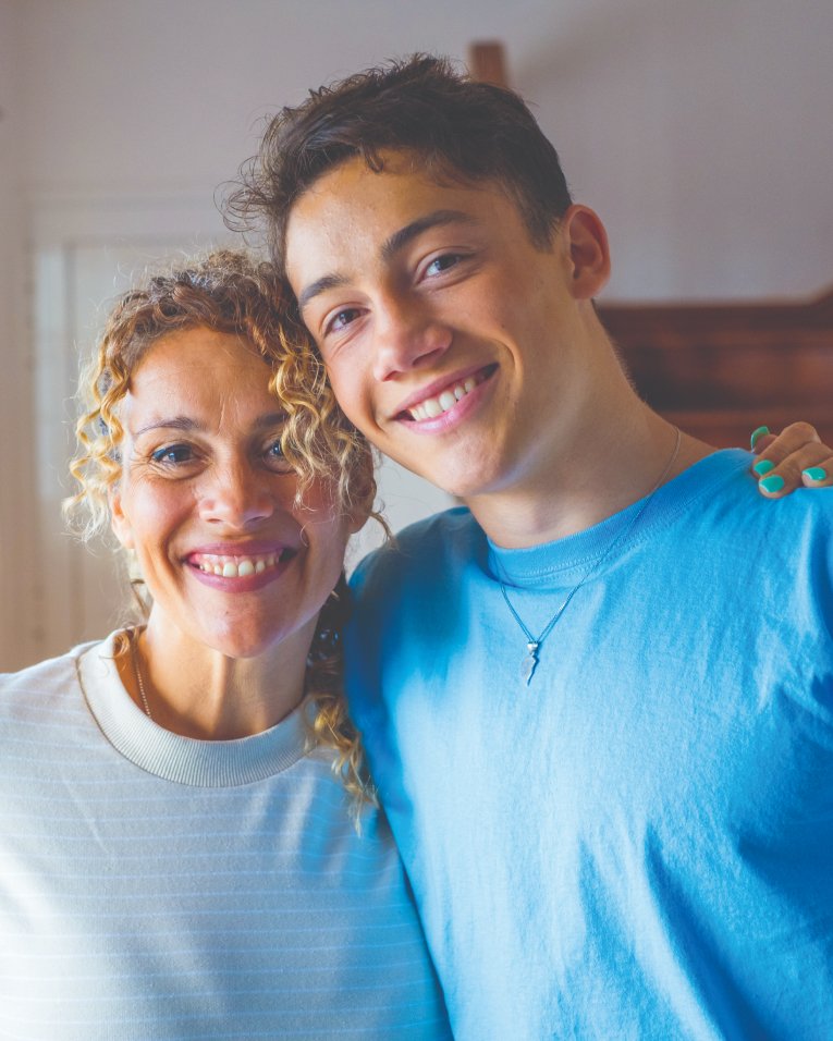 latino-mother-teen-son-smiling-supportive-parenting-content latino mother teen son smiling supportive parenting content
